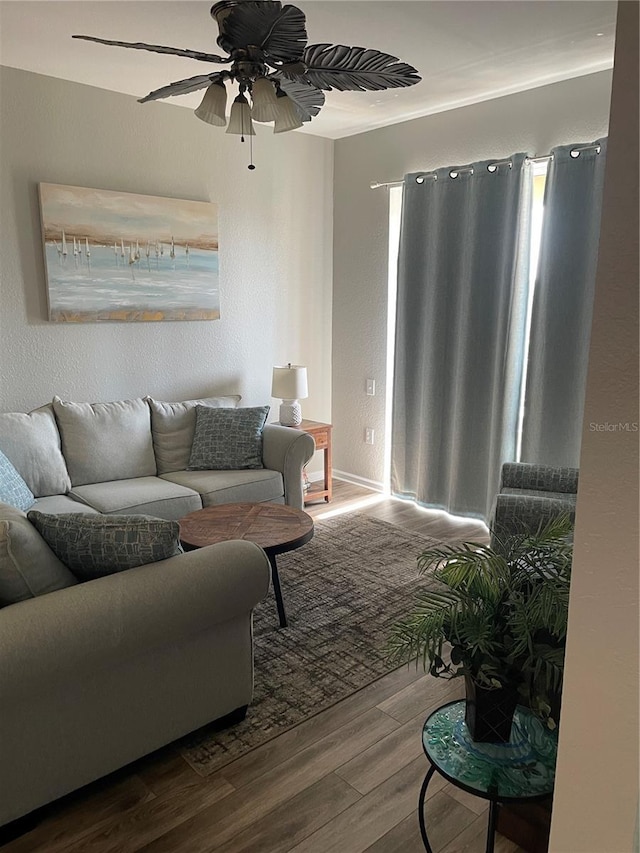 2817 Almaton Loop Unit 403, Kissimmee, FL 34747 - living area featuring wood finished floors and a ceiling fan