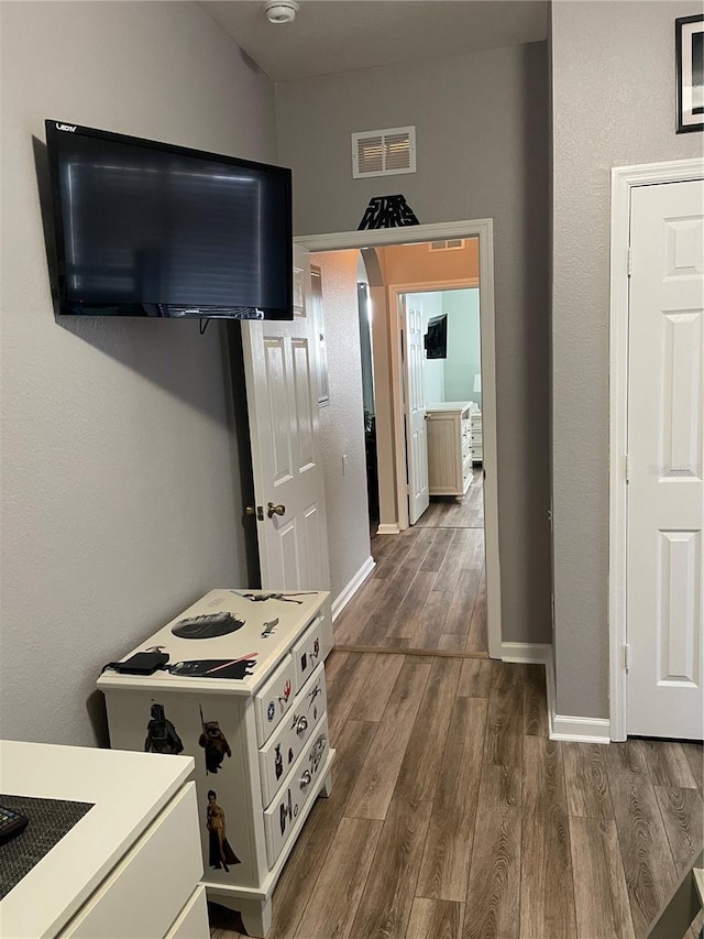 2817 Almaton Loop Unit 403, Kissimmee, FL 34747 - corridor with baseboards and dark wood-type flooring