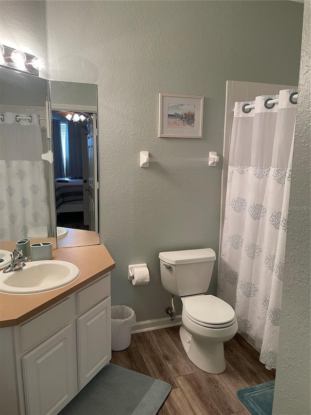 2817 Almaton Loop Unit 403, Kissimmee, FL 34747 - bathroom featuring vanity, wood finished floors, and a shower with shower curtain