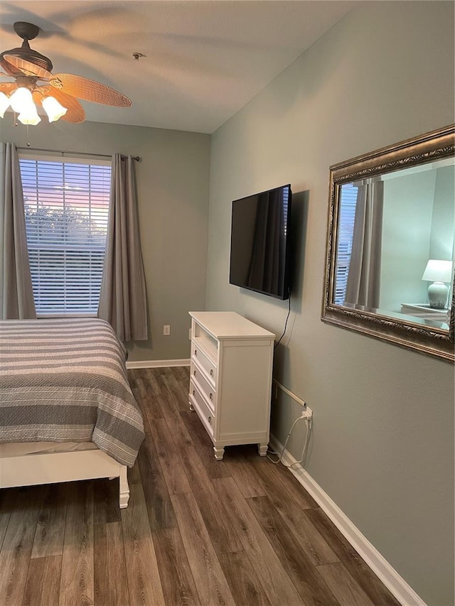 2817 Almaton Loop Unit 403, Kissimmee, FL 34747 - bedroom featuring dark wood finished floors and a ceiling fan