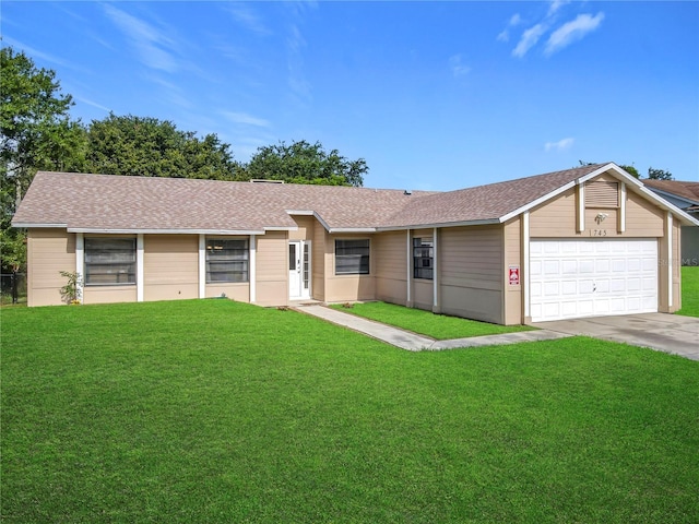 745 Mentmore Cir, Deltona, FL 32738 - single story home featuring concrete driveway, a front yard, and a garage