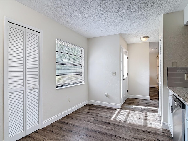 745 Mentmore Cir, Deltona, FL 32738 - unfurnished dining area featuring wood finished floors and a textured ceiling