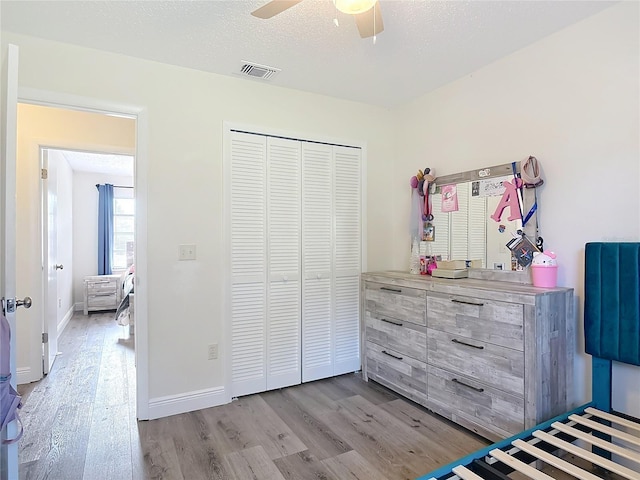 745 Mentmore Cir, Deltona, FL 32738 - bedroom featuring wood finished floors, a closet, and ceiling fan