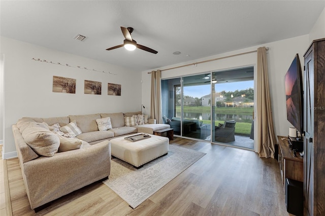 4920 Blanche Ct, Saint Cloud, FL 34772 - living room with a ceiling fan and light wood-style flooring
