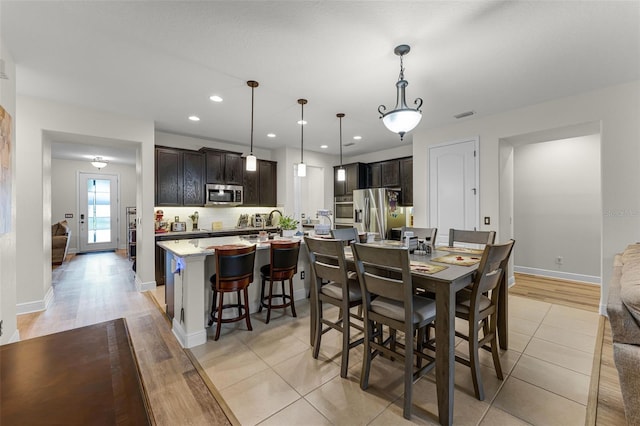 4920 Blanche Ct, Saint Cloud, FL 34772 - dining space with recessed lighting and light tile patterned floors