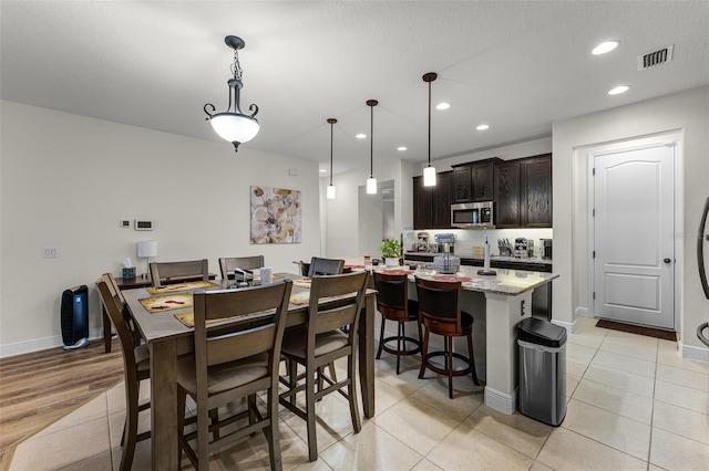 4920 Blanche Ct, Saint Cloud, FL 34772 - dining space featuring recessed lighting and light tile patterned flooring