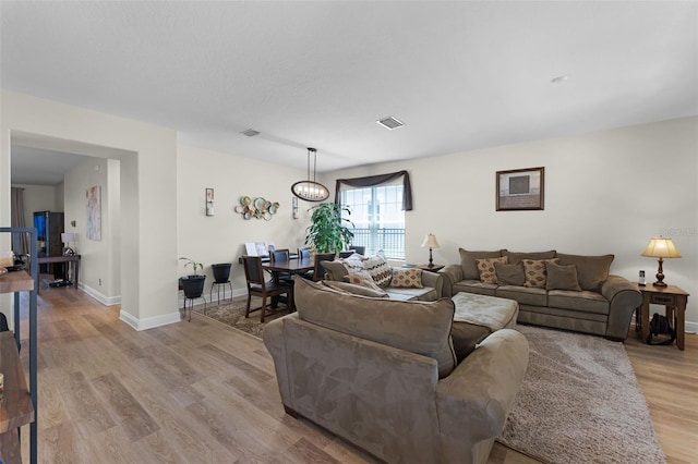 4920 Blanche Ct, Saint Cloud, FL 34772 - living room featuring wood finished floors and baseboards