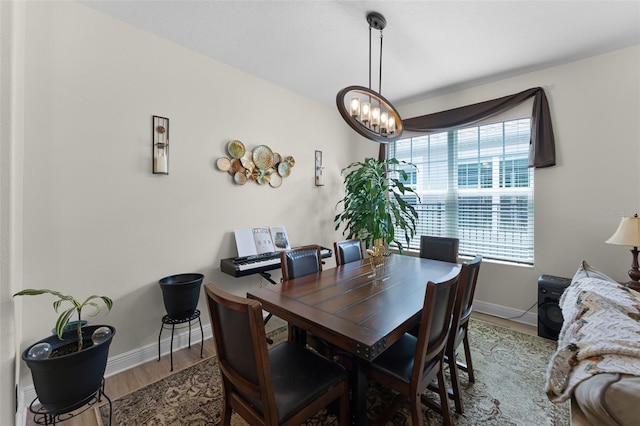 4920 Blanche Ct, Saint Cloud, FL 34772 - dining area with wood finished floors and a chandelier
