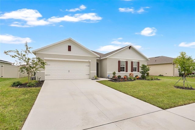 612 Auburn Grove Ter, Auburndale, FL 33823 - ranch-style home featuring a garage, driveway, a front yard, and stucco siding