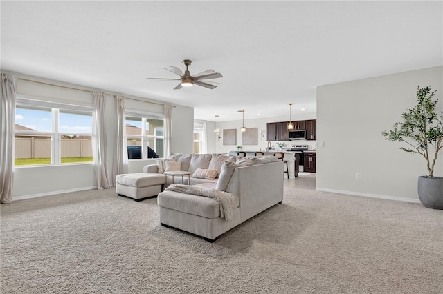 612 Auburn Grove Ter, Auburndale, FL 33823 - living room with a ceiling fan and light colored carpet