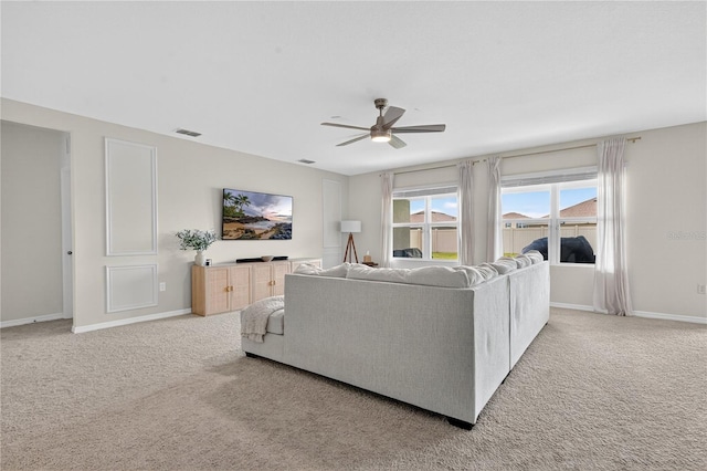 612 Auburn Grove Ter, Auburndale, FL 33823 - living room featuring a ceiling fan and light colored carpet