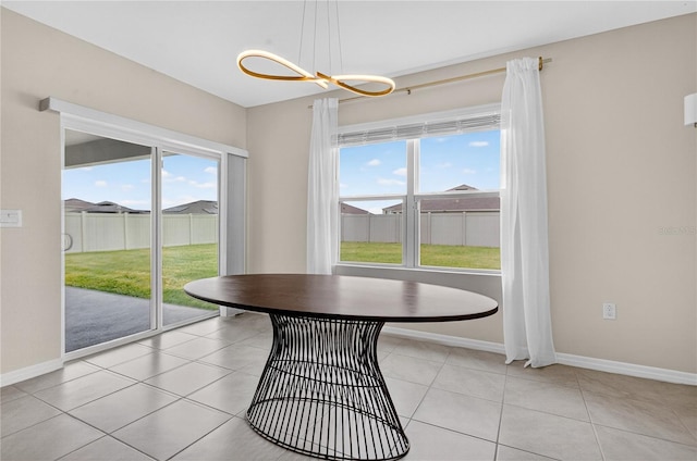 612 Auburn Grove Ter, Auburndale, FL 33823 - dining area featuring healthy amount of natural light, a chandelier, and light tile patterned flooring