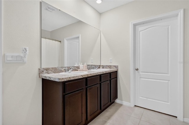 612 Auburn Grove Ter, Auburndale, FL 33823 - full bath featuring double vanity and tile patterned flooring