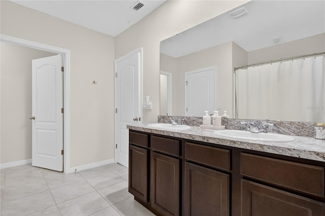 612 Auburn Grove Ter, Auburndale, FL 33823 - full bathroom with double vanity and tile patterned floors