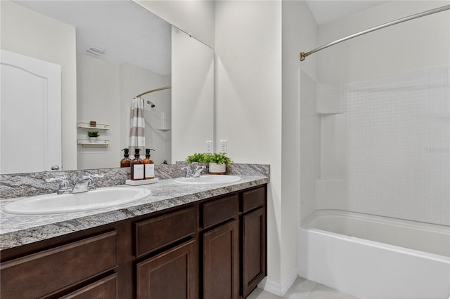 612 Auburn Grove Ter, Auburndale, FL 33823 - full bathroom featuring shower / bath combo with shower curtain, double vanity, and tile patterned floors