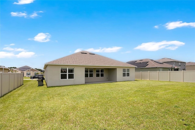 612 Auburn Grove Ter, Auburndale, FL 33823 - rear view of property with stucco siding, roof with shingles, and a residential view