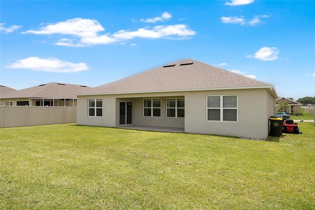 612 Auburn Grove Ter, Auburndale, FL 33823 - back of house with stucco siding and roof with shingles