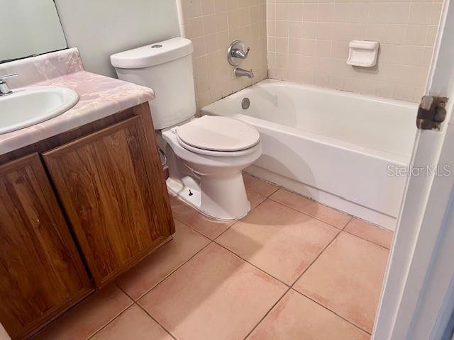 19 W Country Cove Way, Kissimmee, FL 34743 - bathroom with vanity, tile patterned flooring, and tub / shower combination