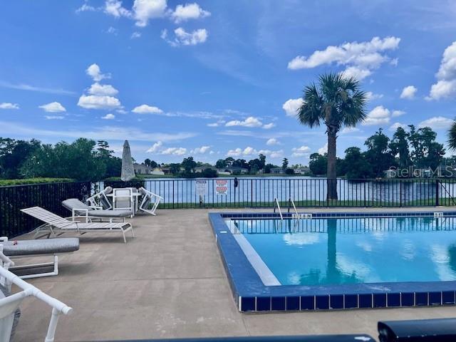 19 W Country Cove Way, Kissimmee, FL 34743 - community pool featuring a patio area
