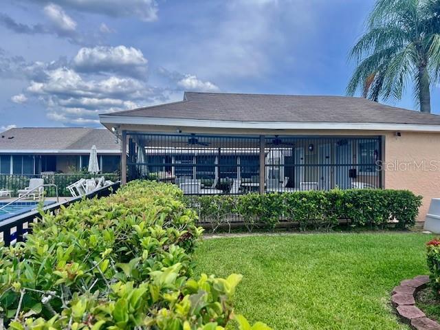 19 W Country Cove Way, Kissimmee, FL 34743 - rear view of property featuring stucco siding
