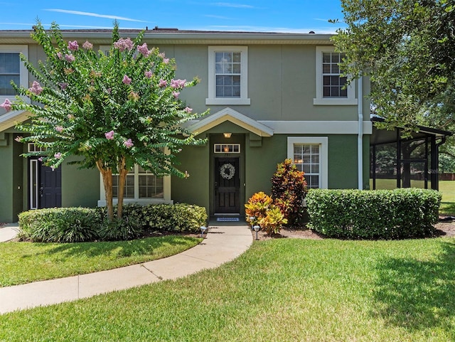 741 Ashworth Overlook Dr Unit B, Apopka, FL 32712 - view of front of home featuring stucco siding and a front yard