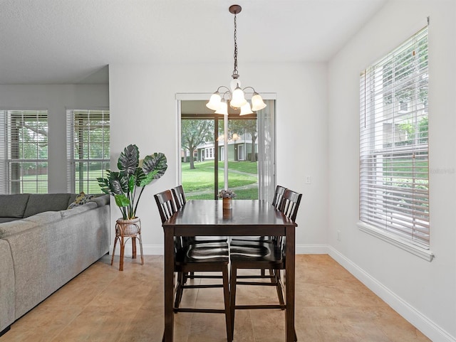 741 Ashworth Overlook Dr Unit B, Apopka, FL 32712 - dining space featuring a chandelier, plenty of natural light, and light tile patterned floors