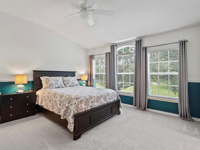 741 Ashworth Overlook Dr Unit B, Apopka, FL 32712 - bedroom featuring light colored carpet, lofted ceiling, multiple windows, and ceiling fan