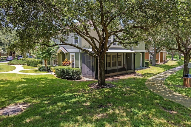 741 Ashworth Overlook Dr Unit B, Apopka, FL 32712 - back of house featuring a lawn, a sunroom, and stucco siding