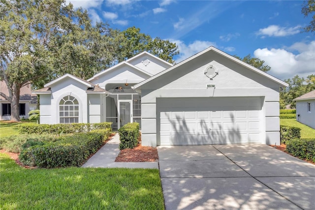 3507 Tenby Cir, Clermont, FL 34711 - ranch-style home with stucco siding, a garage, and driveway