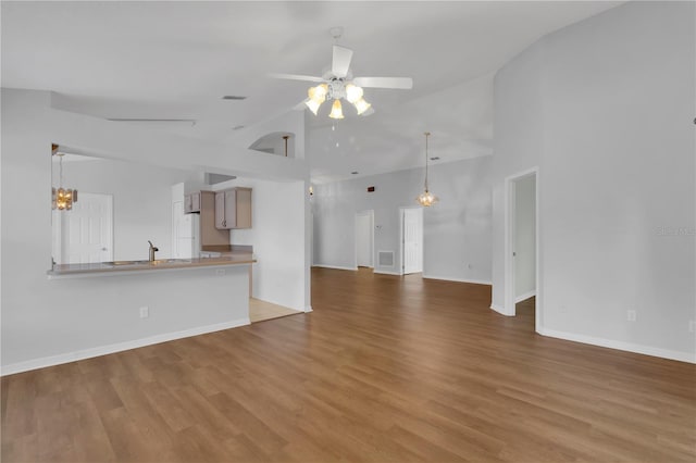 3507 Tenby Cir, Clermont, FL 34711 - unfurnished living room featuring ceiling fan, high vaulted ceiling, and wood finished floors