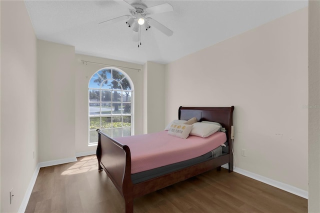 3507 Tenby Cir, Clermont, FL 34711 - bedroom featuring wood finished floors and a ceiling fan