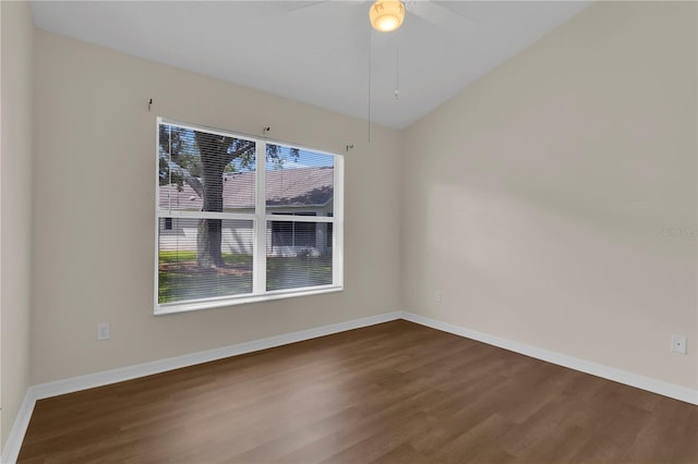 3507 Tenby Cir, Clermont, FL 34711 - spare room with dark wood finished floors, ceiling fan, and lofted ceiling