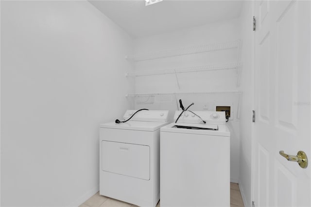 3507 Tenby Cir, Clermont, FL 34711 - laundry room featuring washing machine and dryer and light tile patterned floors