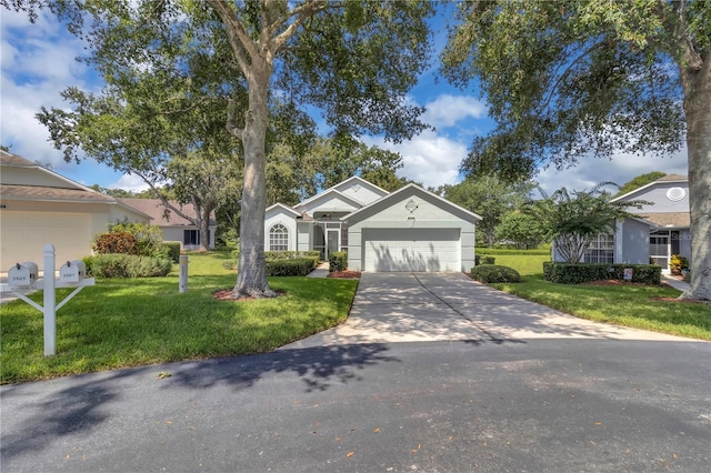 3507 Tenby Cir, Clermont, FL 34711 - ranch-style home with concrete driveway, a front yard, and an attached garage