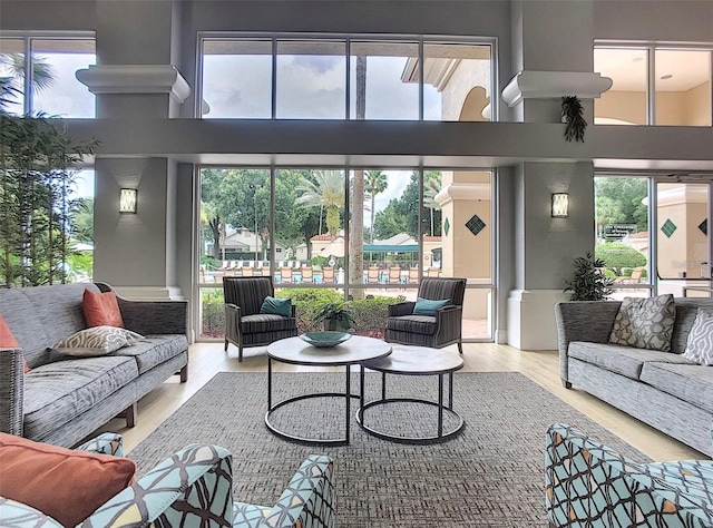 3507 Tenby Cir, Clermont, FL 34711 - living room featuring a towering ceiling, healthy amount of natural light, and wood finished floors