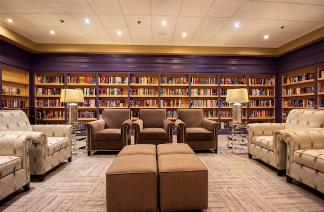 3507 Tenby Cir, Clermont, FL 34711 - sitting room featuring bookshelves, carpet, built in features, and recessed lighting