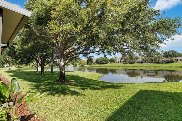 6059 Twain St Unit 108, Orlando, FL 32835 - view of grassy yard featuring a water view