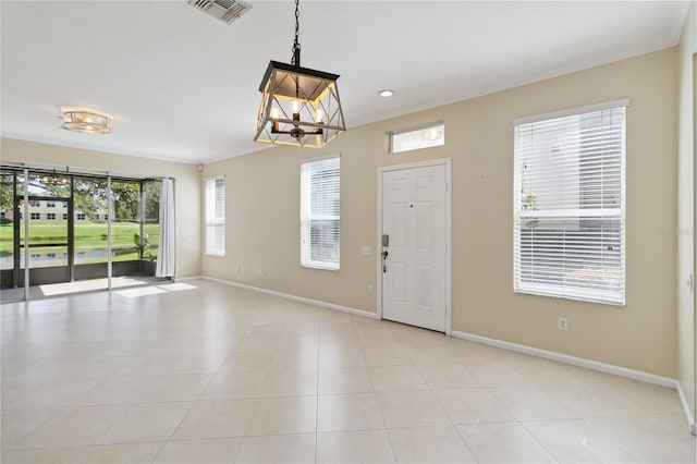 6059 Twain St Unit 108, Orlando, FL 32835 - foyer featuring a chandelier and ornamental molding