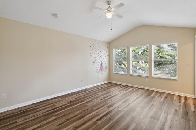 6059 Twain St Unit 108, Orlando, FL 32835 - empty room with wood finished floors, a ceiling fan, vaulted ceiling, and a smoke detector