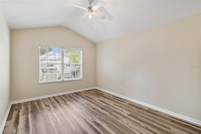 6059 Twain St Unit 108, Orlando, FL 32835 - unfurnished room with wood finished floors, lofted ceiling, and a ceiling fan