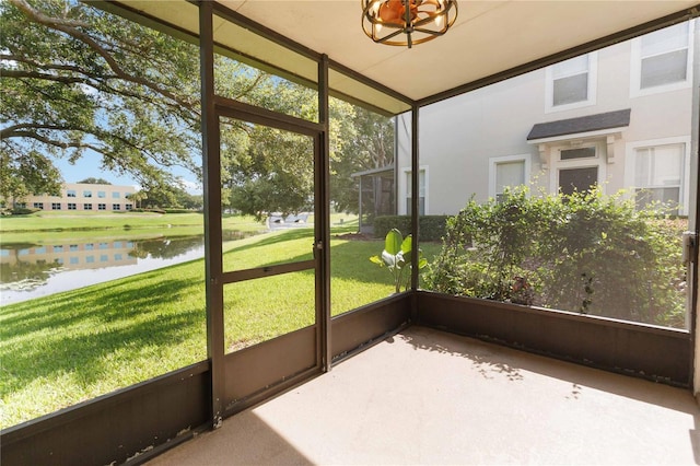 6059 Twain St Unit 108, Orlando, FL 32835 - unfurnished sunroom with a water view, plenty of natural light, lofted ceiling, and a chandelier