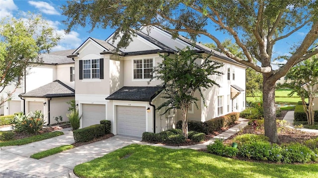 6059 Twain St Unit 108, Orlando, FL 32835 - traditional-style house featuring stucco siding, concrete driveway, an attached garage, and a shingled roof