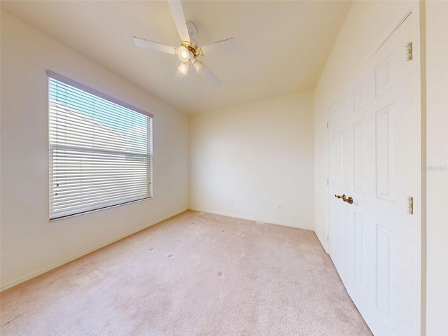 7985 Saint Giles Pl, Orlando, FL 32835 - unfurnished bedroom with light carpet and a ceiling fan
