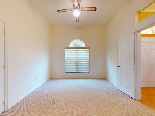 7985 Saint Giles Pl, Orlando, FL 32835 - empty room with carpet flooring, healthy amount of natural light, and a ceiling fan