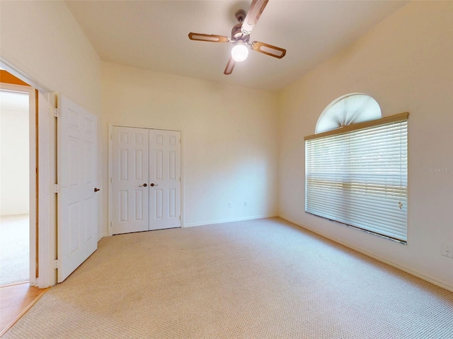 7985 Saint Giles Pl, Orlando, FL 32835 - unfurnished bedroom featuring carpet floors, a closet, and a ceiling fan
