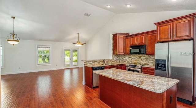 957 Southridge Trl, Altamonte Springs, FL 32714 - kitchen with stainless steel appliances, a kitchen island, tasteful backsplash, a peninsula, and dark wood-style floors