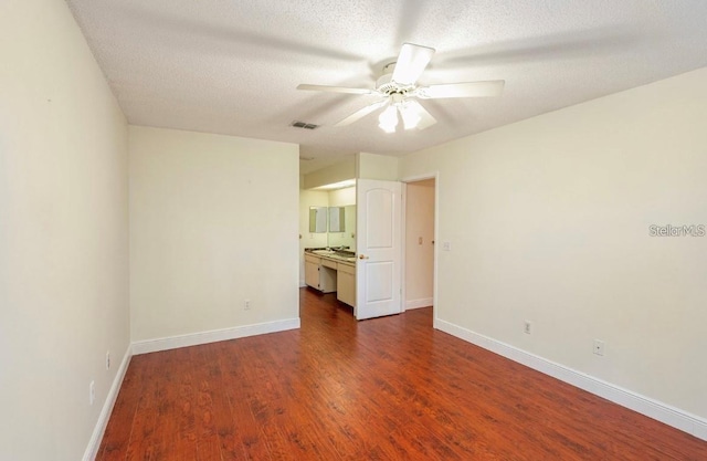 957 Southridge Trl, Altamonte Springs, FL 32714 - empty room featuring ceiling fan, dark wood-type flooring, and a textured ceiling
