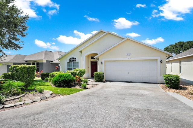 1520 Gulf Vue Dr, Haines City, FL 33844 - ranch-style home featuring concrete driveway, an attached garage, and stucco siding