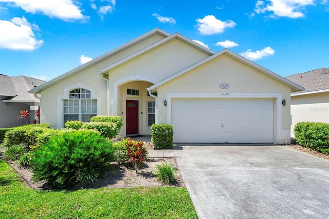 1520 Gulf Vue Dr, Haines City, FL 33844 - single story home with concrete driveway, an attached garage, and stucco siding