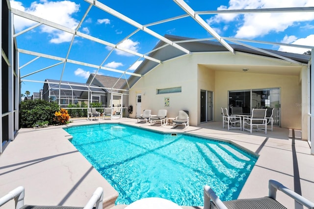 1520 Gulf Vue Dr, Haines City, FL 33844 - swimming pool with a patio area, glass enclosure, and outdoor dining space